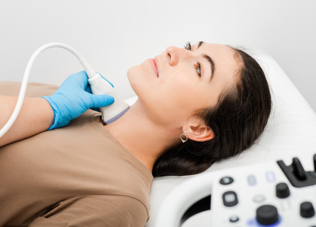 Female patient receives thyroid diagnostics. Treatment of thyrotoxicosis, and hypothyroidism