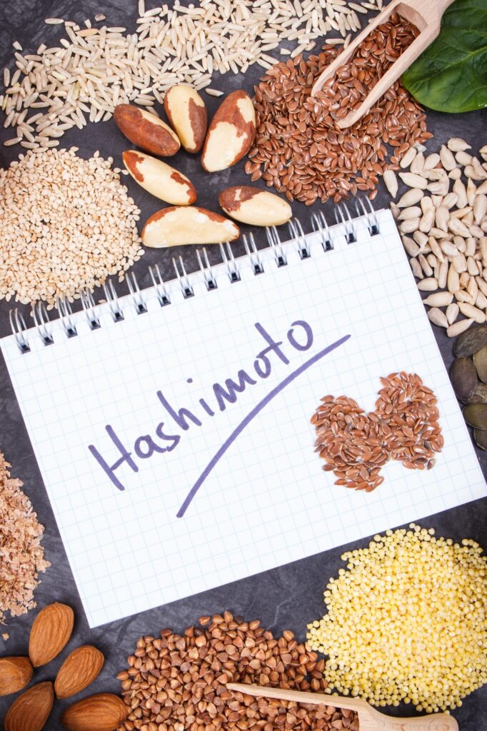 Notepad with inscription hashimoto and best ingredients for healthy thyroid